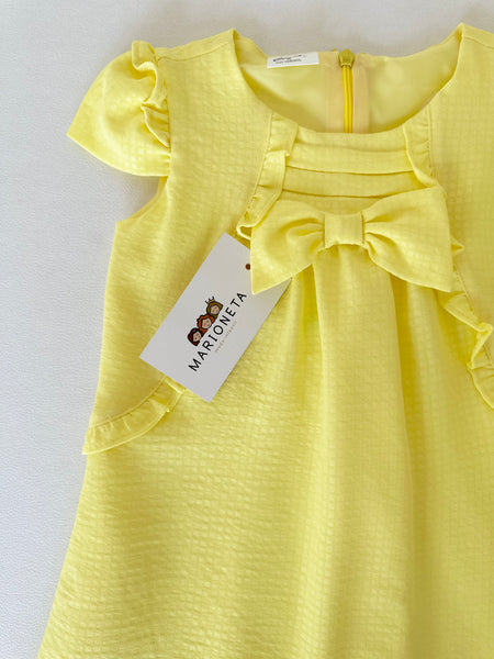 Vestido amarillo con olanes y lazo al frente con adorno para el cabello | Mexcana